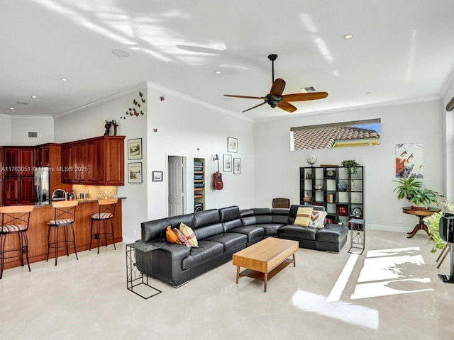 living room with crown molding, visible vents, a ceiling fan, and recessed lighting