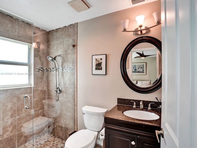 full bathroom featuring visible vents, toilet, a stall shower, and vanity