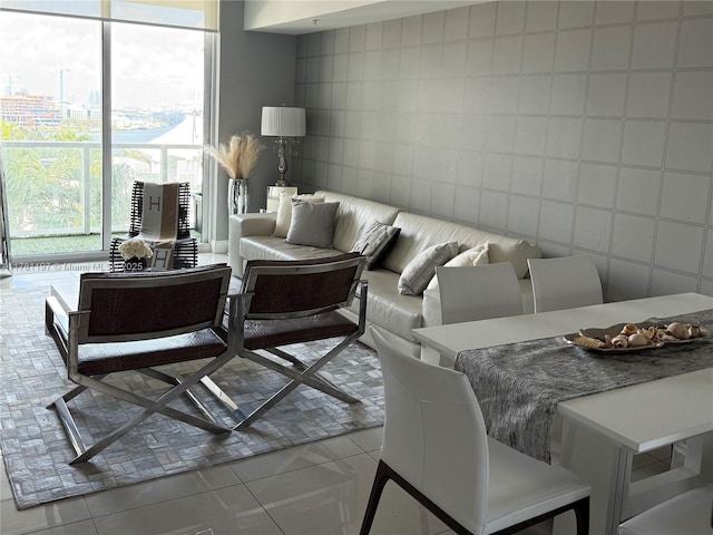 253 NE 2nd St Unit 1003, Miami, FL 33132 - living room featuring tile walls and plenty of natural light