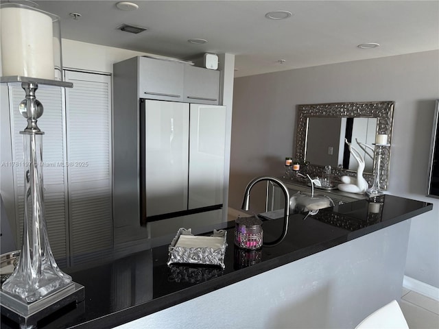 253 NE 2nd St Unit 1003, Miami, FL 33132 - kitchen featuring dark countertops and modern cabinets