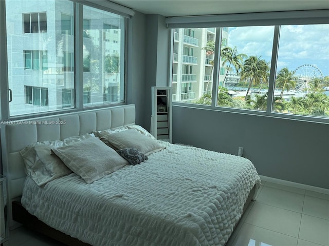 253 NE 2nd St Unit 1003, Miami, FL 33132 - bedroom with tile patterned floors and baseboards