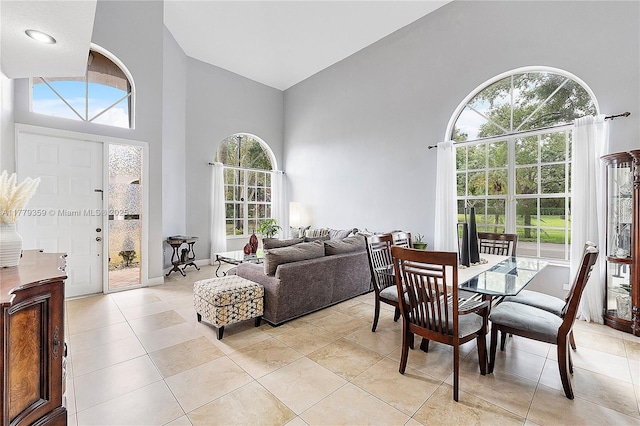 1008 NW 116th Ave, Coral Springs, FL 33071 - dining space with a towering ceiling and light tile patterned floors
