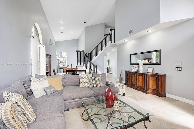 1008 NW 116th Ave, Coral Springs, FL 33071 - living area with high vaulted ceiling, light tile patterned floors, recessed lighting, and stairs