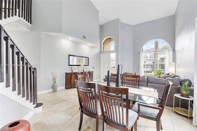 1008 NW 116th Ave, Coral Springs, FL 33071 - dining room with a high ceiling, light tile patterned floors, and stairs