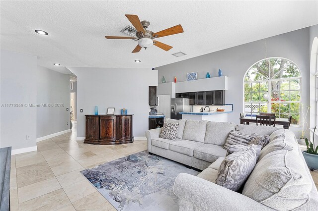 1008 NW 116th Ave, Coral Springs, FL 33071 - living area with ceiling fan, a textured ceiling, recessed lighting, and light tile patterned flooring