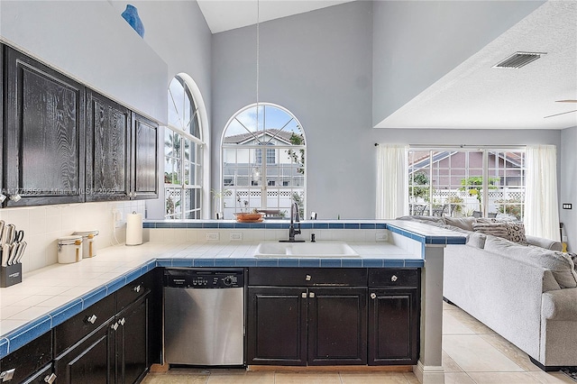 1008 NW 116th Ave, Coral Springs, FL 33071 - kitchen featuring dishwasher, open floor plan, a towering ceiling, tile counters, and a peninsula