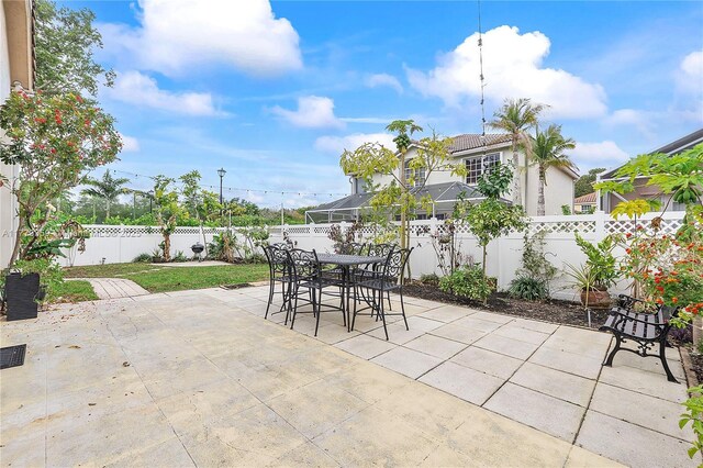 1008 NW 116th Ave, Coral Springs, FL 33071 - fenced backyard featuring a patio area and outdoor dining space