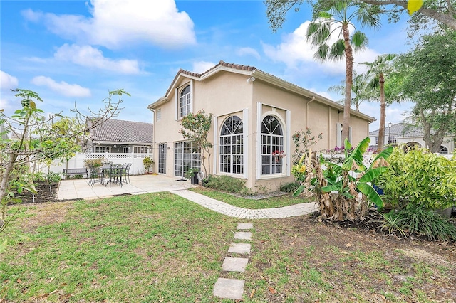 1008 NW 116th Ave, Coral Springs, FL 33071 - back of house featuring stucco siding and a patio area