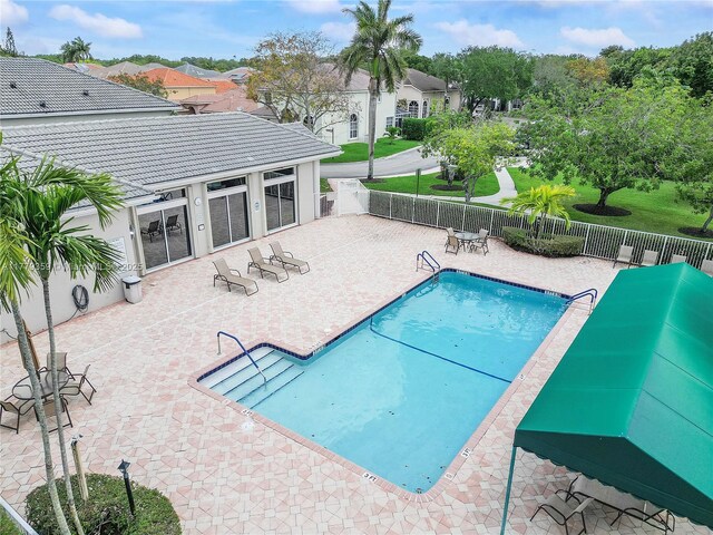 1008 NW 116th Ave, Coral Springs, FL 33071 - community pool featuring a patio