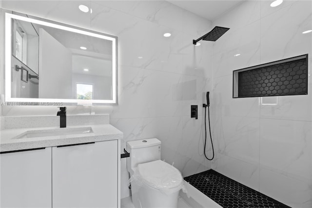 full bathroom featuring vanity, tile walls, walk in shower, and toilet