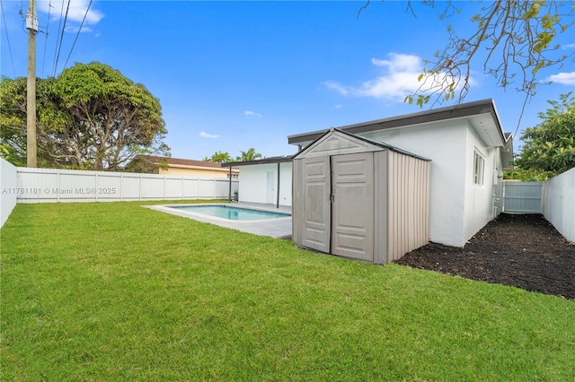 exterior space with a fenced in pool, an outdoor structure, a fenced backyard, and a storage shed