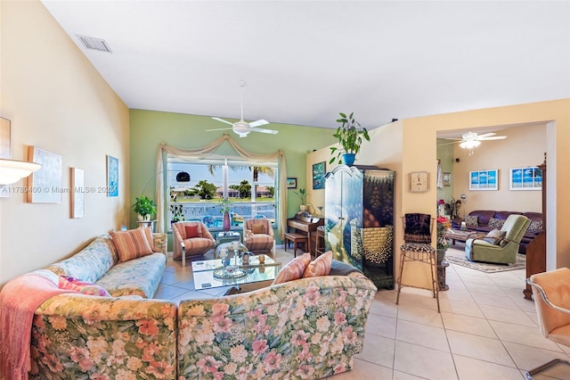 tiled living room with visible vents and a ceiling fan