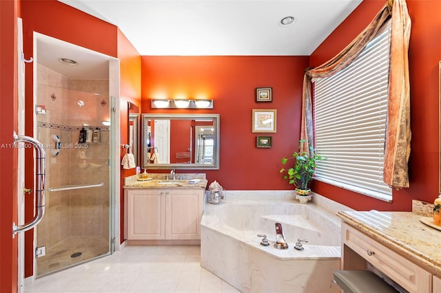 full bathroom featuring a shower stall, tile patterned floors, vanity, and a bath
