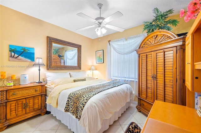 bedroom featuring ceiling fan and light tile patterned flooring