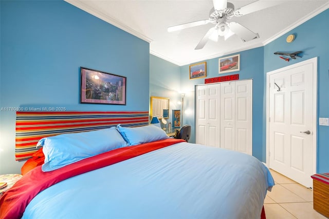 bedroom featuring crown molding, a closet, ceiling fan, and tile patterned flooring