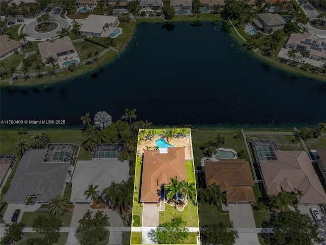 bird's eye view with a water view and a residential view