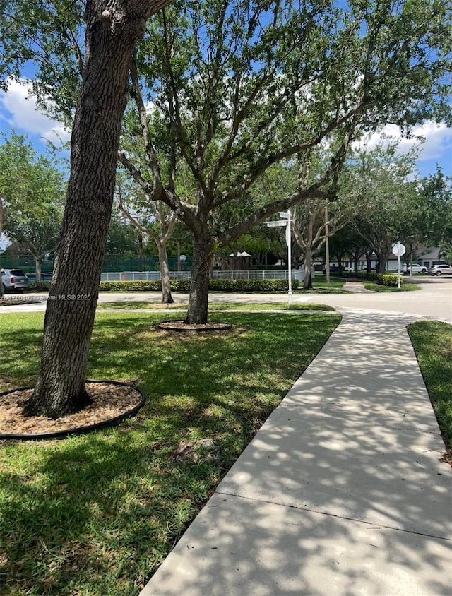 surrounding community featuring a lawn