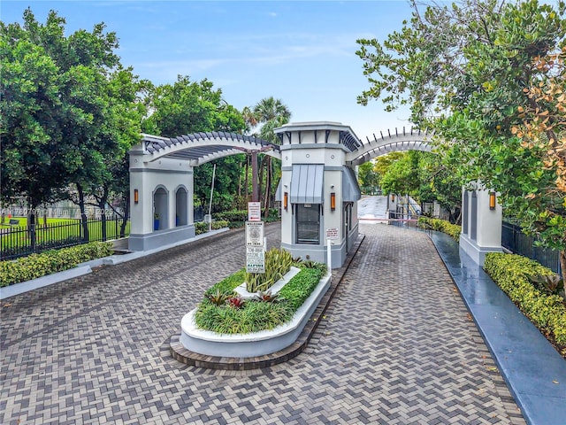 311 Poinciana Dr Unit 801, Sunny Isles Beach, FL 33160 - view of community with a pergola and fence