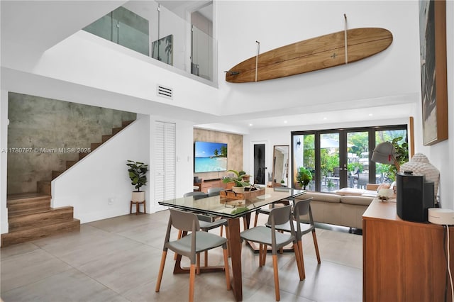 311 Poinciana Dr Unit 801, Sunny Isles Beach, FL 33160 - dining area featuring visible vents, recessed lighting, stairway, a high ceiling, and french doors
