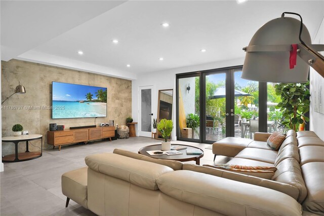 311 Poinciana Dr Unit 801, Sunny Isles Beach, FL 33160 - living area featuring french doors, an accent wall, and recessed lighting