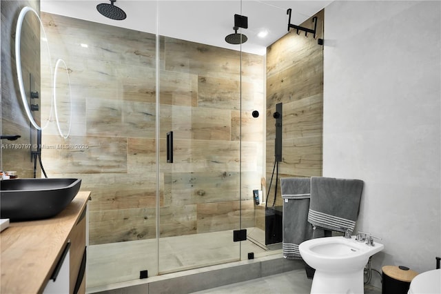 311 Poinciana Dr Unit 801, Sunny Isles Beach, FL 33160 - bathroom featuring a shower stall, a bidet, vanity, and tile walls