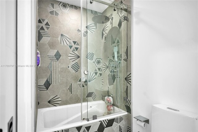 311 Poinciana Dr Unit 801, Sunny Isles Beach, FL 33160 - bathroom featuring toilet and tiled shower / bath