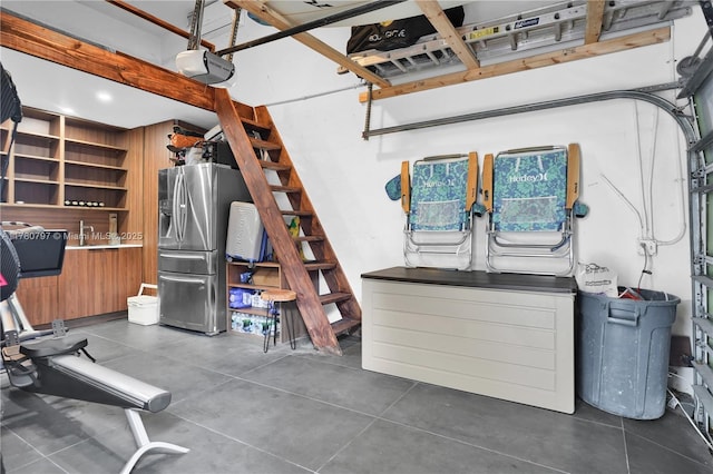 311 Poinciana Dr Unit 801, Sunny Isles Beach, FL 33160 - garage featuring stainless steel fridge with ice dispenser and a garage door opener
