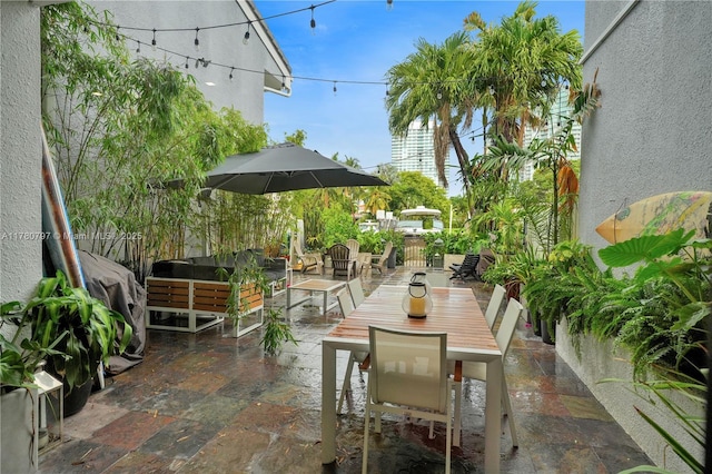 311 Poinciana Dr Unit 801, Sunny Isles Beach, FL 33160 - view of patio / terrace featuring outdoor dining space and outdoor lounge area