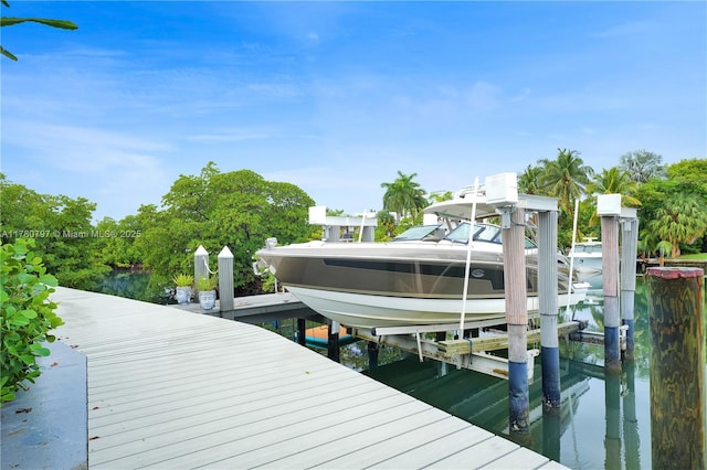 311 Poinciana Dr Unit 801, Sunny Isles Beach, FL 33160 - dock area with a water view and boat lift
