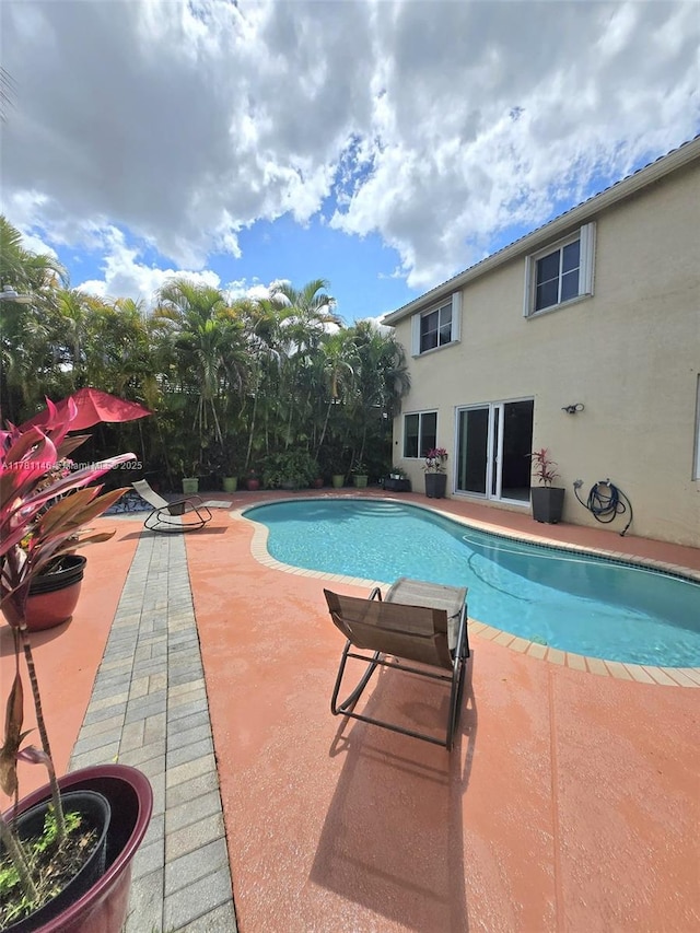 outdoor pool with a patio