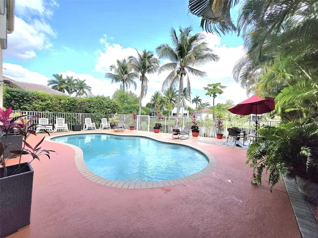 view of swimming pool with a fenced in pool, a patio area, and fence