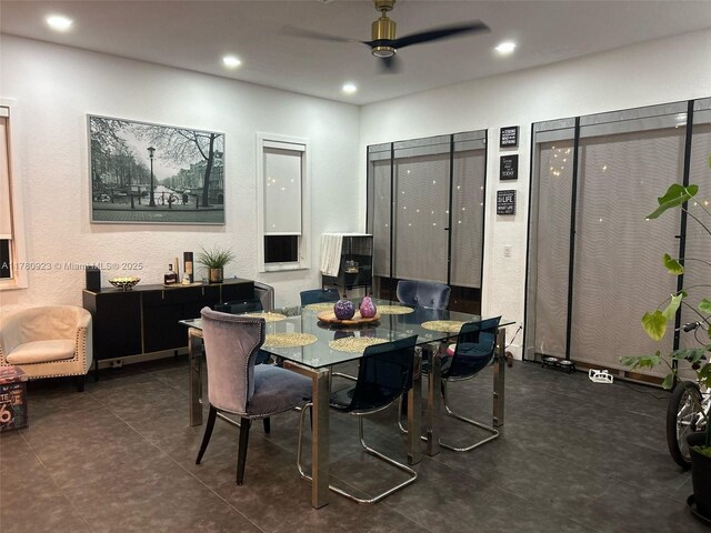tiled dining space featuring ceiling fan and recessed lighting