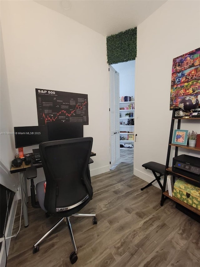 office area featuring baseboards and wood finished floors