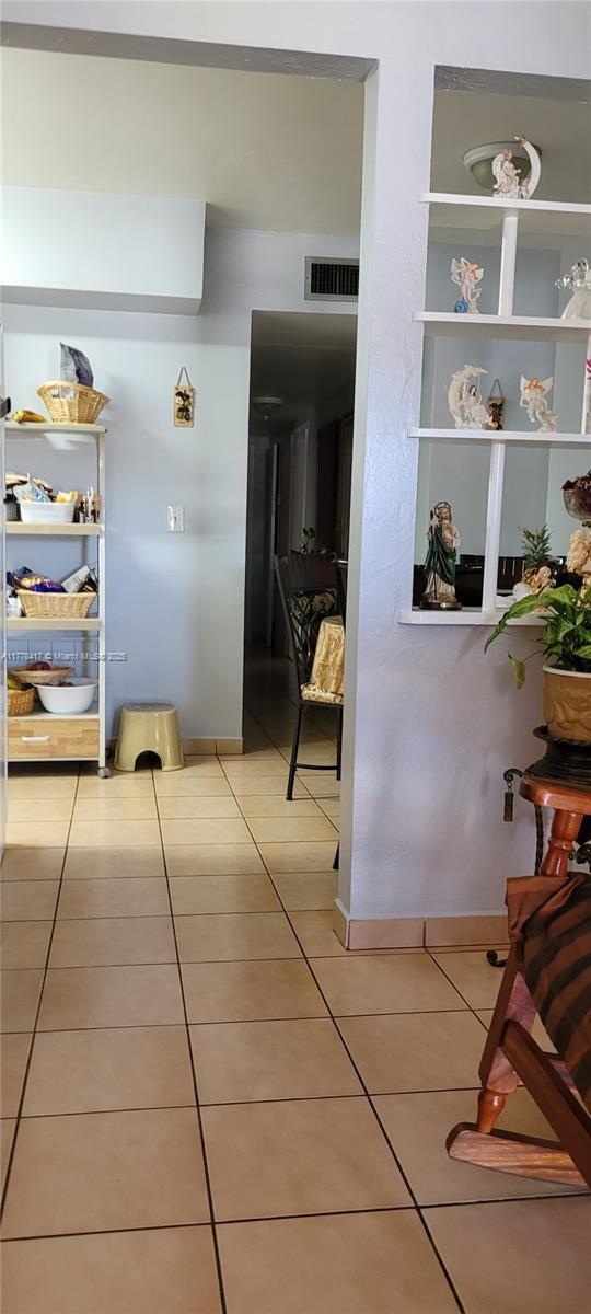2911 SW 2nd St, Miami, FL 33135 - hall with light tile patterned floors