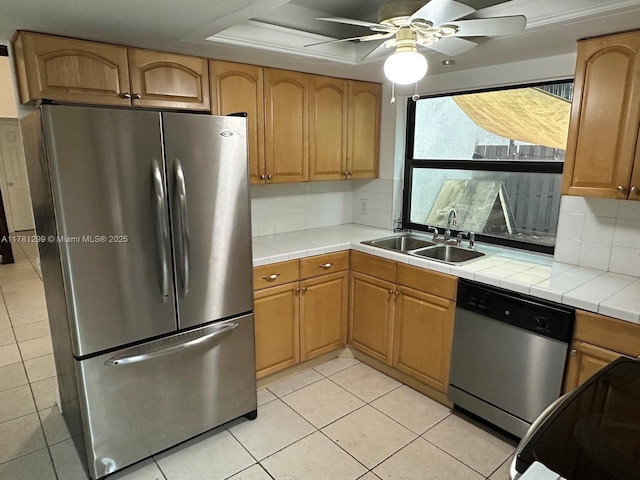 11035 SW 132nd Ct Unit 13-3, Miami, FL 33186 - kitchen featuring tile counters, stainless steel appliances, light tile patterned floors, and a sink