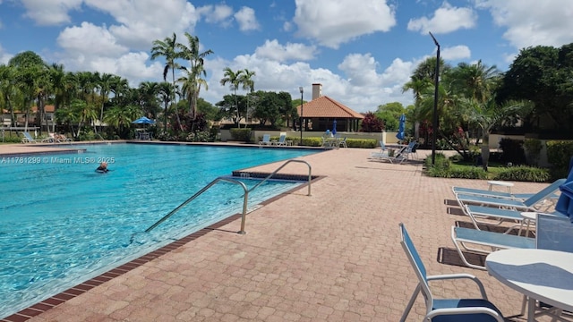 11035 SW 132nd Ct Unit 13-3, Miami, FL 33186 - pool with a gazebo and a patio area