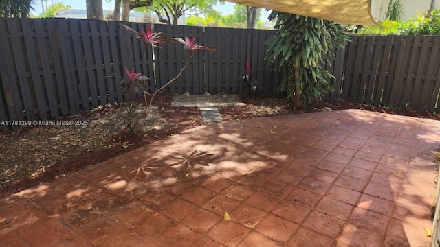 11035 SW 132nd Ct Unit 13-3, Miami, FL 33186 - view of patio with a fenced backyard