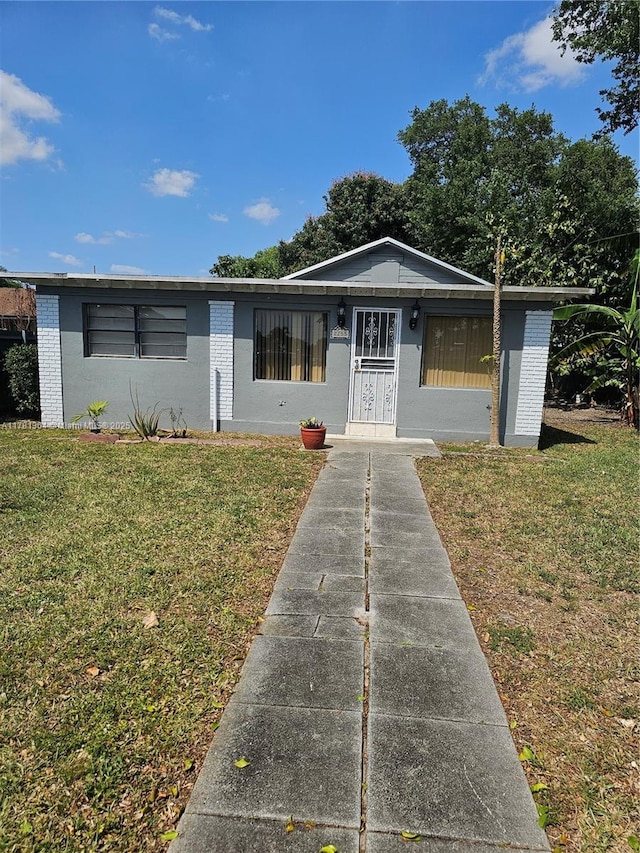 2255 NW 85th St, Miami, FL 33147 - view of front of house featuring a front yard