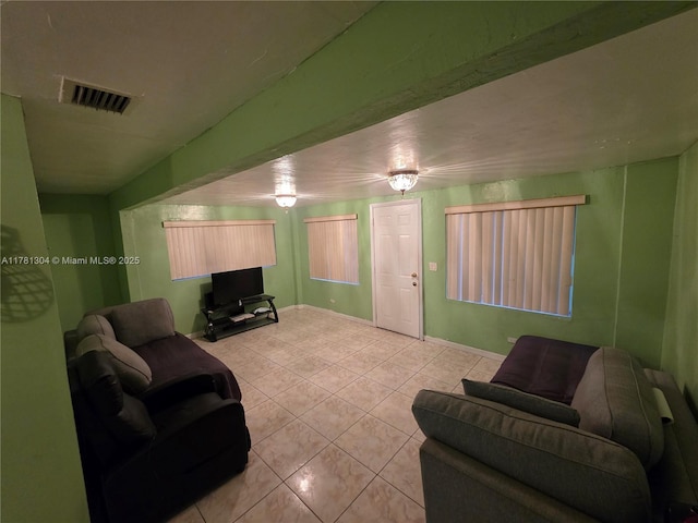2255 NW 85th St, Miami, FL 33147 - living area featuring light tile patterned floors, visible vents, and baseboards
