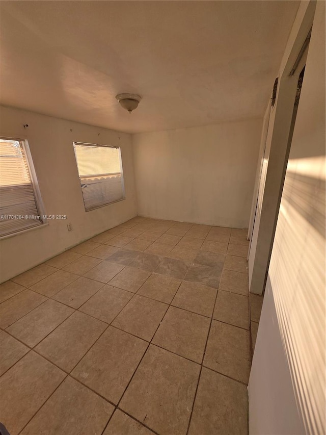 2255 NW 85th St, Miami, FL 33147 - empty room with light tile patterned floors