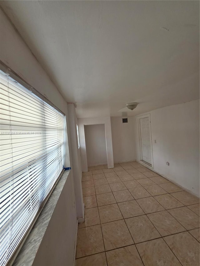 2255 NW 85th St, Miami, FL 33147 - empty room with light tile patterned floors and visible vents