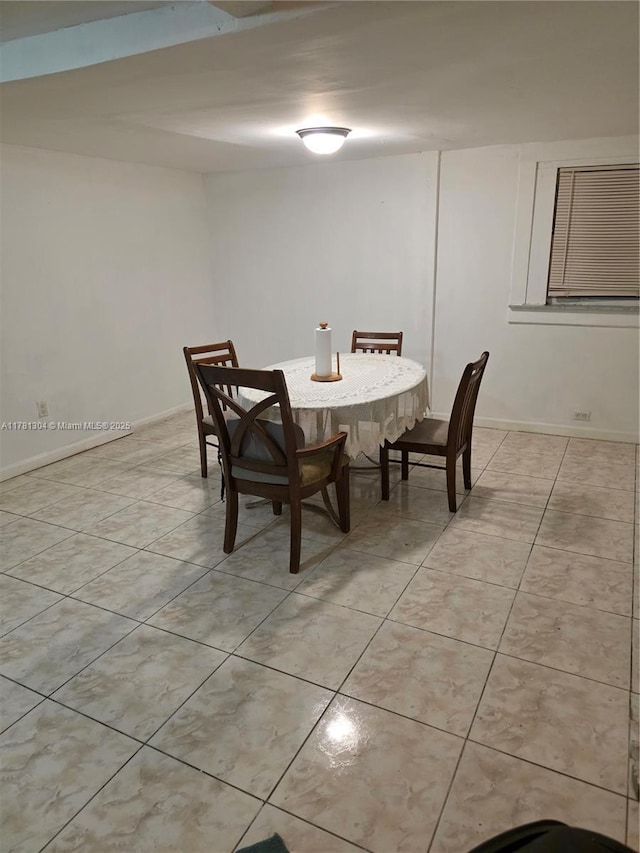 2255 NW 85th St, Miami, FL 33147 - dining space with light tile patterned floors and baseboards