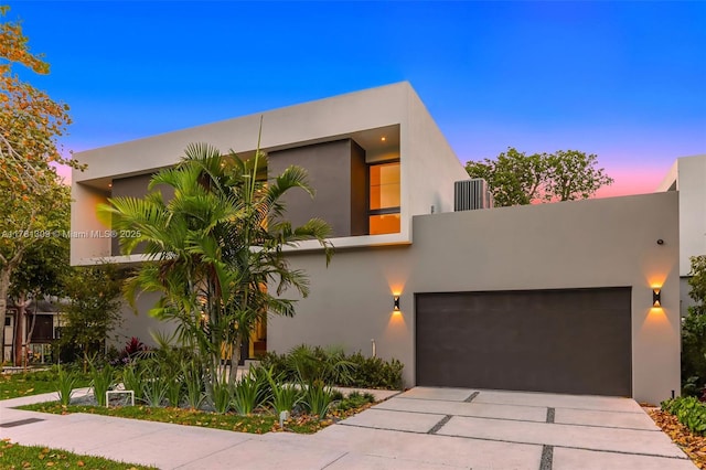 2851 W Trade Ave, Miami, FL 33133 - modern home with a garage, driveway, and stucco siding