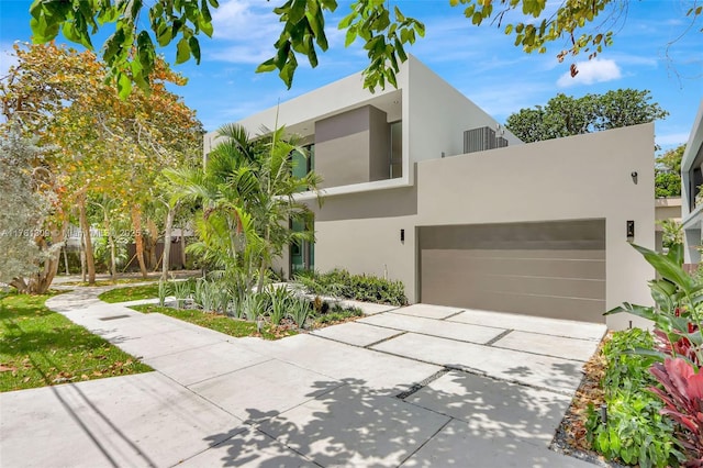 2851 W Trade Ave, Miami, FL 33133 - contemporary home featuring driveway and stucco siding