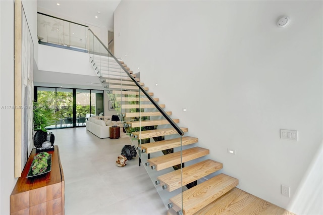 2851 W Trade Ave, Miami, FL 33133 - staircase with a high ceiling