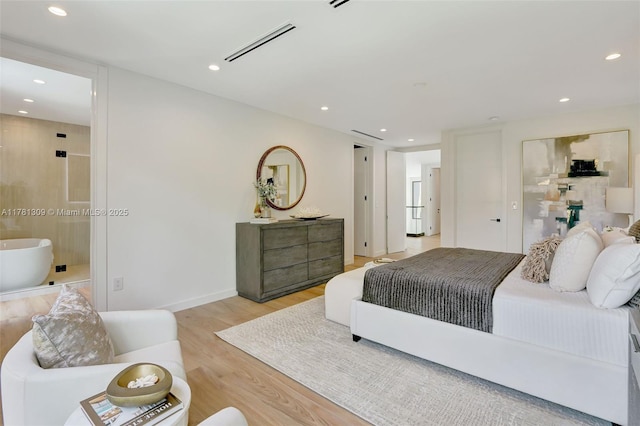 2851 W Trade Ave, Miami, FL 33133 - bedroom featuring visible vents, baseboards, light wood-style floors, recessed lighting, and ensuite bath