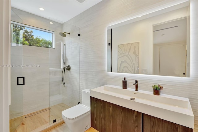 2851 W Trade Ave, Miami, FL 33133 - bathroom featuring a shower stall, toilet, vanity, and tile walls