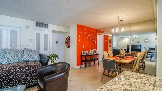 17011 N Bay Rd Unit 701, Sunny Isles Beach, FL 33160 - interior space with visible vents, baseboards, light tile patterned floors, an inviting chandelier, and a textured ceiling