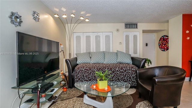 17011 N Bay Rd Unit 701, Sunny Isles Beach, FL 33160 - living area with visible vents and a textured ceiling