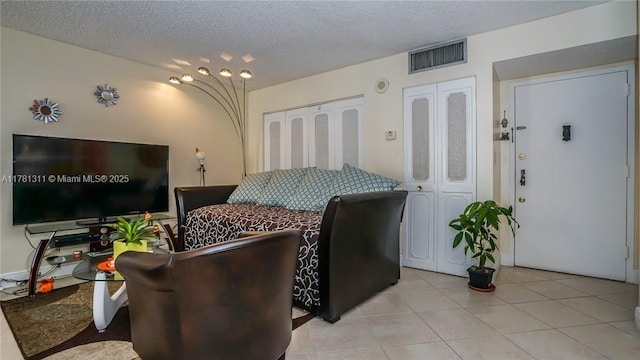 17011 N Bay Rd Unit 701, Sunny Isles Beach, FL 33160 - living room featuring visible vents, a textured ceiling, and light tile patterned flooring